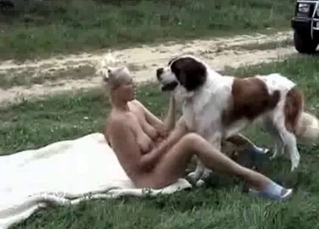 Busty babe loves outdoor bestiality