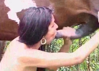 Brunette sucks an animal wiener