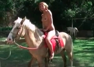 Redhead rides her sexy stallion