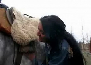 Young girl and horny stallion