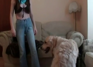 Girl drilled by dog on couch