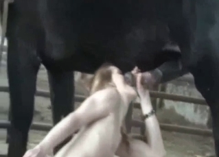 Pale blonde from Russia blows a horse