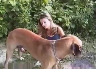 Blond-haired chick enjoys dog BJs