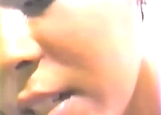 Dark-haired lady deepthroats a brown dog's cock